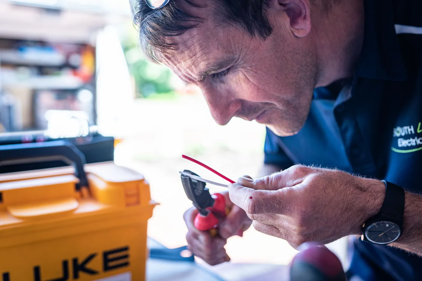 Electrician wiring a device