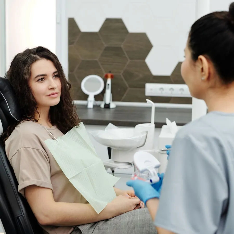 A patient smiling in the dental chair
