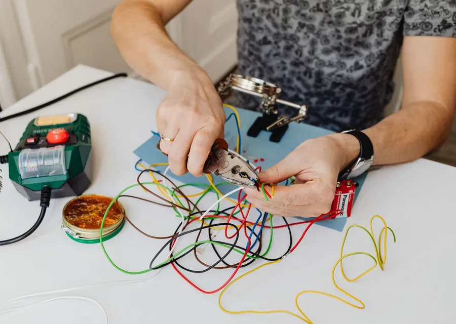 An electrician testing wiring